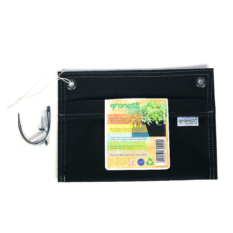 Gronest® fabric wall plant pots hanging on a white wall with green plants growing out of them.